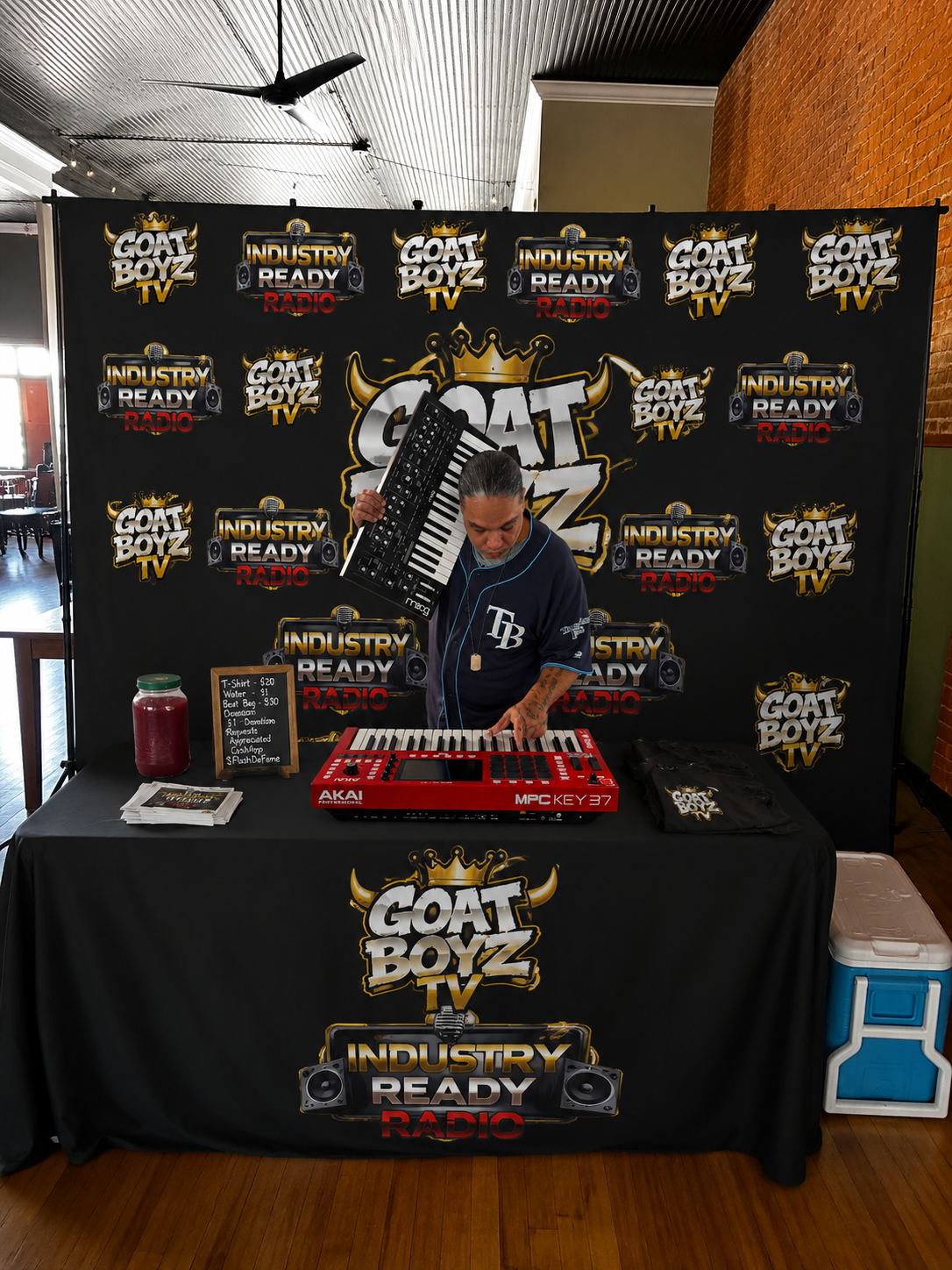 Flash Finga Flame at a GOAT Boyz TV and Industry Ready Radio setup